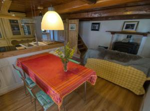 a living room with a table and a couch at Stones and Pines in Rimella