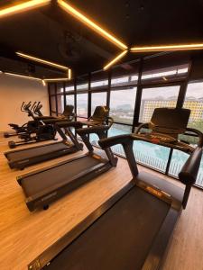 a group of treadmills in a gym with a view at Piccadilly Greentown Ipoh by Jun - City Views in Ipoh