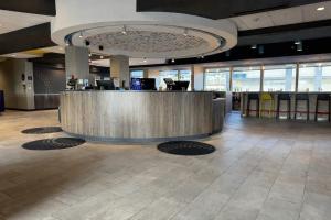 a lobby with a reception desk in a building at Tru By Hilton Harrisonburg, Va in Harrisonburg