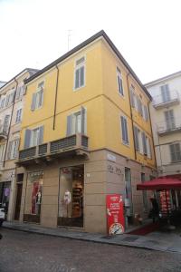 a yellow building on the side of a street at Nuvola di Parma// del Ducato 1 in Parma