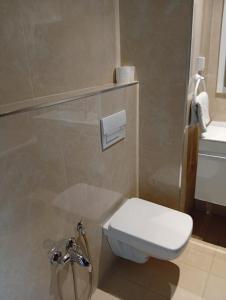 a bathroom with a toilet and a sink at Apartment cosy in Sidi Daoud +5 photos