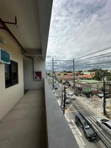 a balcony of a building with a view of a street at RV3 TRANSIENT HOUSE in Angeles