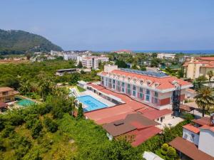an aerial view of a building with a swimming pool at Pera Aura Resort Hotel & Spa - All Inclusive in Kemer +25 photos
