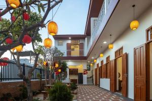 a hallway of a building with orange lights at Homestay Hòn Đỏ Sea in Thôn Mỹ Tường