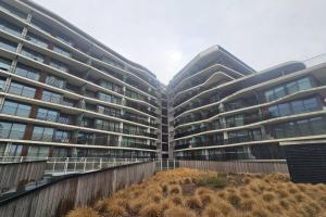 an apartment building with a yard in front of it at Christel Residence in Ostend