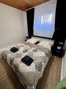 a bedroom with a bed with two pillows on it at Bad Rothenfelde Residence in Bad Rothenfelde