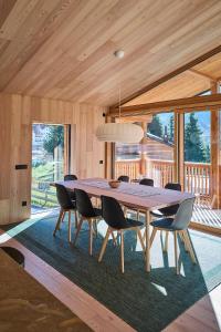 a dining room with a table and chairs at Eagle & Marmot, Carezza Dolomites in Carezza al Lago