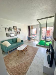 a living room with a couch and a table at appartement T2 cabine cap d'agde in Cap d'Agde