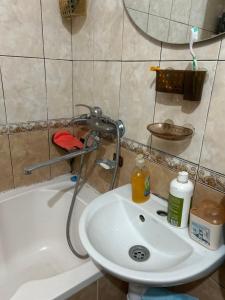 a bathroom with a sink and a bath tub at Очень Уютная, Тихая, Эко Комната С Видом На Сад in Vinnytsya +70 photos