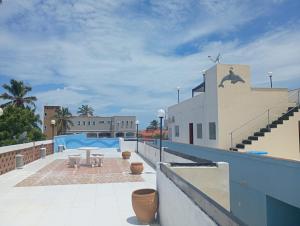 a view of a swimming pool from a building at POUSADA GOLFINHO FLECHEIRAS Ce in Trairi