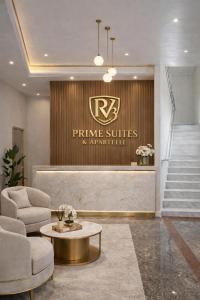 a hotel lobby with a table and chairs and stairs at RV3 Prime Suites & Apartelle in Angeles