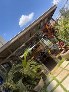 a building with palm trees in front of it at Sk home in Kiambu