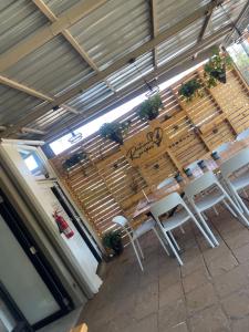 a restaurant with chairs and a table with plants at Sk home in Kiambu +34 photos