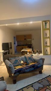 a living room with a couch in the middle of a room at Beach Village Rest in Tarrafal +19 photos