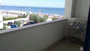 a balcony with a view of a parking lot at Midnight sun pomposa lido in Lido di Pomposa
