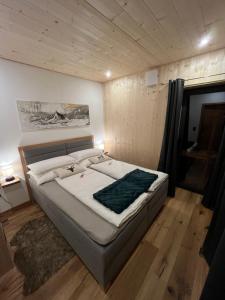 a bedroom with a large bed in a room at Saalach Chalet in Lofer