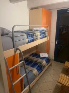 a bunk bed room with two bunk beds in it at Midnight sun pomposa lido in Lido di Pomposa