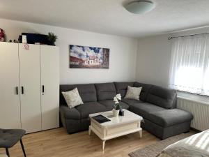 a living room with a couch and a coffee table at Studio Apartman Karlo in Zaprešić