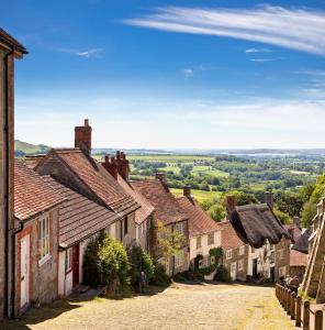 an empty street in a village with houses at Townhouse in Shaftesbury