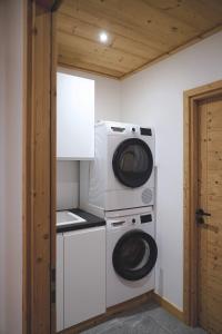 a laundry room with a washer and dryer at Beautiful chalet with views in Montgenèvre
