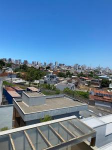 a view of a city from the roof of a building at Quarto próx a Praia do Morro in Guarapari