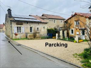 a house with the words parking in front of it at Le Cosy 8km du futuroscope in Beaumont