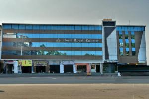 a large glass building with a hotel room pharmacy at Hotel Royal Embassy in Bhilwara