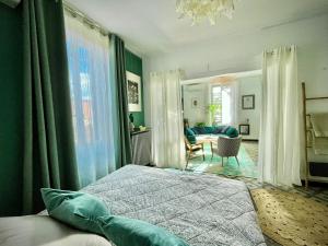 a bedroom with a bed and a living room at La maison Gerval in Bédoin +51 photos