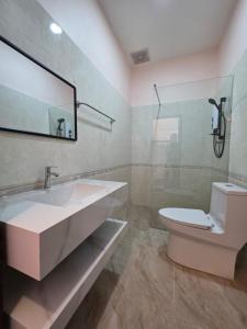 a bathroom with a sink and a toilet at Leego Hotel in Luang Prabang +28 photos