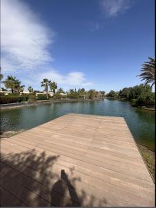 a shadow of a person taking a picture of a lake at VILLA DETENTE PISCINE PRIVEE PROCHE D'AGADlR in Taroudant