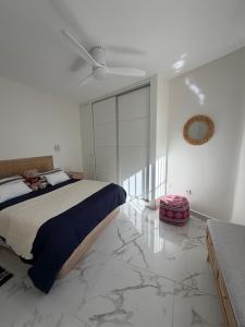 a bedroom with a bed and a marble floor at Mi Sitio in Sitio de Calahonda +43 photos