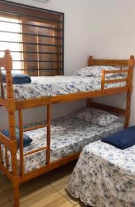 two bunk beds in a room with at Posada - Letiéle in São Gabriel