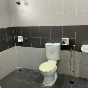 a bathroom with a toilet and a sink at HD DOUBLE-STORY House in Banting +14 photos