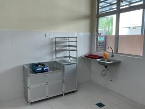 a bathroom with a sink next to a sink at HD DOUBLE-STORY House in Banting