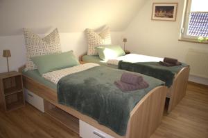 two twin beds in a room with at Ferienhaus Sonnenblick Wernigerode in Wernigerode