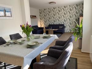 a dining room with a table and chairs at Ferienhaus Sonnenblick Wernigerode in Wernigerode