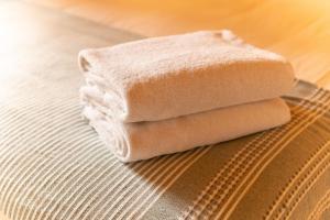 a stack of towels sitting on top of a table at Cabanas Narea in Laxe +91 photos