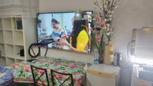 a living room with a tv on the wall at Big Room Ashdod in Ashdod