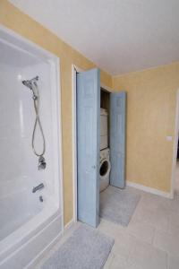 a bathroom with a shower and a toilet at blue house in Saint-Pierre