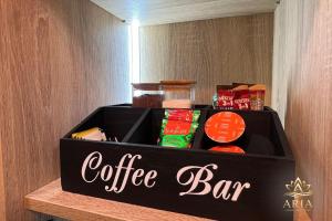 a coffee bar box sitting on top of a shelf at ARIA Luxury Apartment, Tuzla in Tuzla