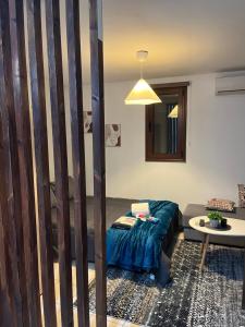 a living room with a couch and a table at ArMA URBAN LIVING in Bendevís