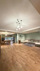 a large living room with couches and a table at Private Pool Villa in Khao Lak