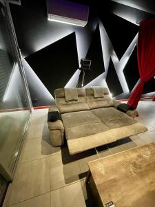 a bedroom with a bed in a room at L unique Cinéma Room in Grenoble