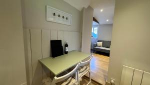 a room with a table with a bottle of wine on it at The Hive in Bream