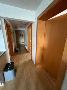 an empty hallway of an apartment with a door at Haus Alpenblick in Bichlbach +1 photo