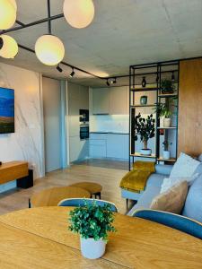 a living room with a couch and a table at Skyline Heaven - Fantastic View - Pool - Garage in Vila Nova de Gaia
