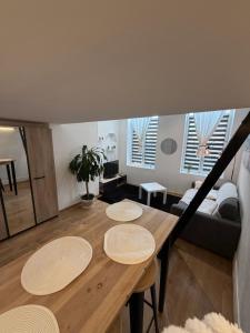 a living room with a table and a couch at LB studio in Dunkerque