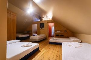 a room with three beds in a attic at Camping de la Rivière Nicolet in Wotton +20 photos