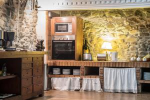 Kuchyň nebo kuchyňský kout v ubytování La Casa Del Reloj
