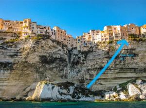 a city on the side of a cliff at Fleur de Falaise in Bonifacio